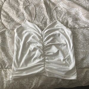 Cream spaghetti strapped crop top with Ruching.